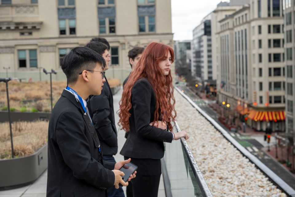 Linus Tang, Ella Pilacek and other finalists look out from the roof of the MLK Jr. Memorial Library.